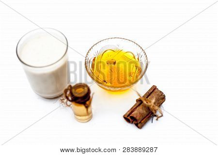 Close Up Of Popular Indian & Asian Winter Drink Isolated On White I.e Honey Milk Or Shahad Ka Dudh I