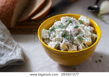 Traditional Cold Potato Salad With Onions And Herbs On A Linen Tablecloth Background. Rustic Style.