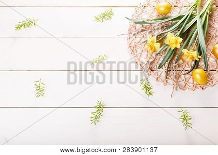 Easter Background With Easter Eggs And Spring Flowers. Top View With Copy Space