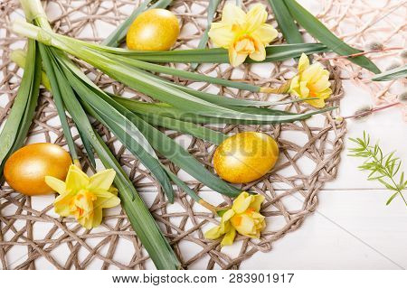 Easter Background With Easter Eggs And Spring Flowers. Top View With Copy Space
