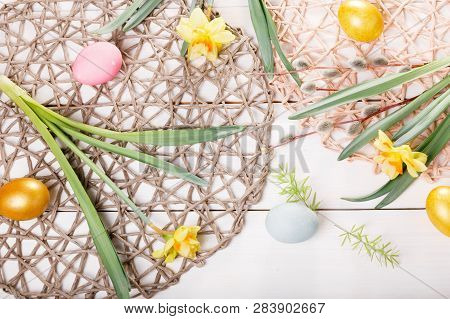Easter Background With Easter Eggs And Spring Flowers. Top View With Copy Space