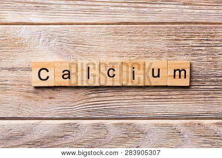 Calcium Word Written On Wood Block. Calcium Text On Wooden Table For Your Desing, Concept