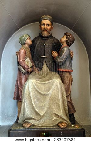 LUSON, ITALY - JULY 14, 2018: Josef Freinademetz missionary in China sculpted by Leonhard Delago of Bula in the Saint George church in Luson, Italy