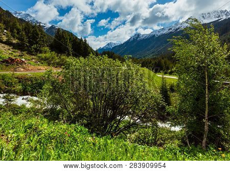 Summer Alps Mountain Landscape With Alpine River And Road (silvretta Alps, Austria).