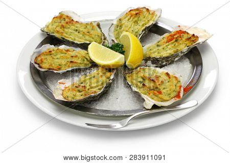 oysters rockfeller, baked oysters on half shell topped with green sauce and bread crumbs