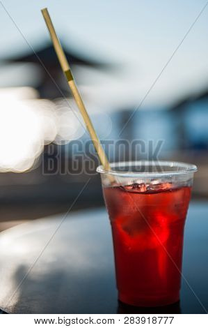 Cool Red Drink On The Beach In The Heat