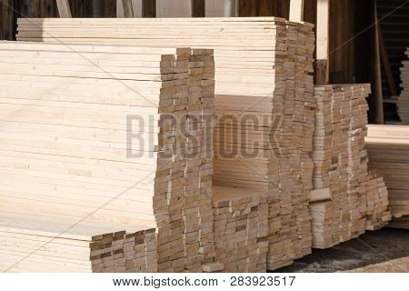 Logs Sawn On The Boards. Sawing Boards. A Lot Of Lumber.