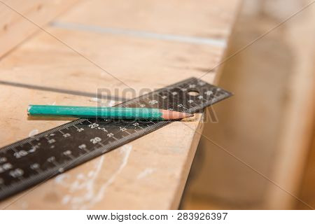 Measure Tree With A Ruler. Measuring Tools In The Carpentry Workshop. Joinery. Draw On Wooden Detail