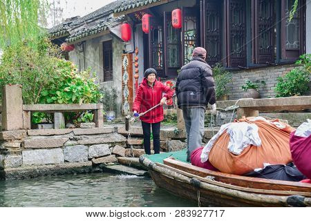 Zhouzhuang,jiangsu,china - December 14 2018 : Unknown People On A Pick-up Boat For The Dry-cleaners 