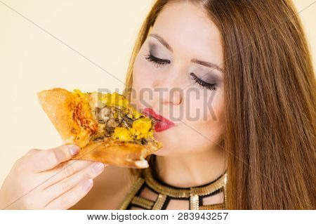 Young Woman Eating Hot Fresh Pizza Slice. Delicious Fast Food Meal. People, Italian Cuisine Concept.
