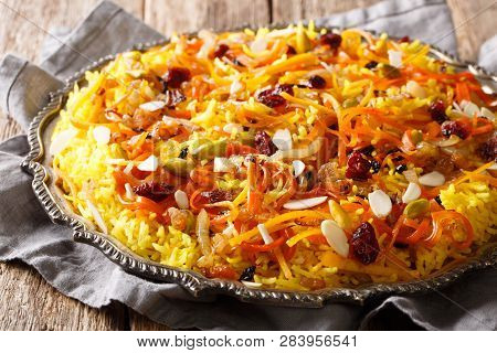 Persian Delicious Pilaf Javaher Polow (jeweled Rice) Closeup On A Plate On The Table. Horizontal