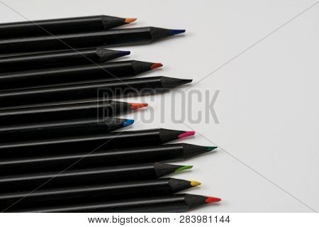Set Beautiful Black, Colored Pencils Of Colored Pencils On White Ground. Back To School.
