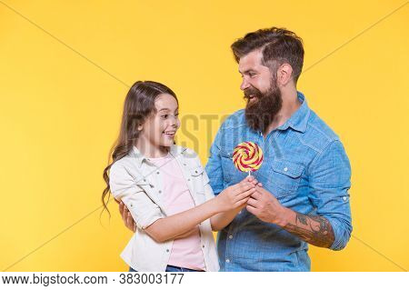 Sweet Surprise. Bearded Man Give Lollipop To Surprised Child. Sweet Tooth Family Yellow Background. 