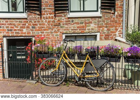 Appingedam, Netherlands - August 08, 2020: Bicycle In Front Of An Old House In Appingedam, Netherlan
