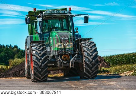 Bavaria / Germany - August 20, 2020: Fendt Tractor With A Loader Wagon, Working On A Biogas Plant