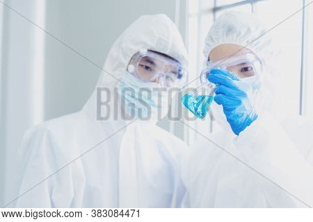 Two Asian Scientist Team Reserch Chemistry Science Tube Experiment Biotech Antibody Sample In Labora