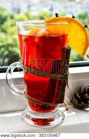 Christmas Mulled Wine With And Orange On Windowsill. Selective Focus. Anise Stars And Cinnamon Stick