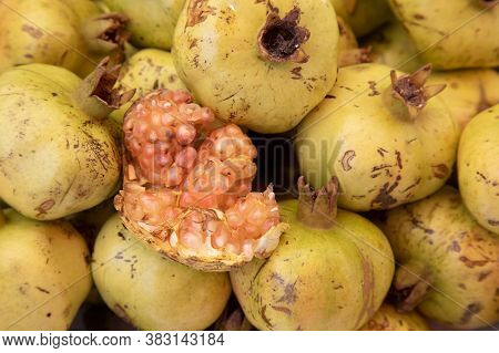 Naatural Organic Pomegranate In The Marketplace As A Background