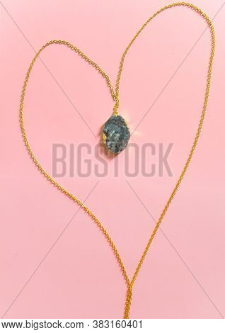 Gold Pendant Necklace With Geode Isolated On Pink Background. Handmade Accessories.
