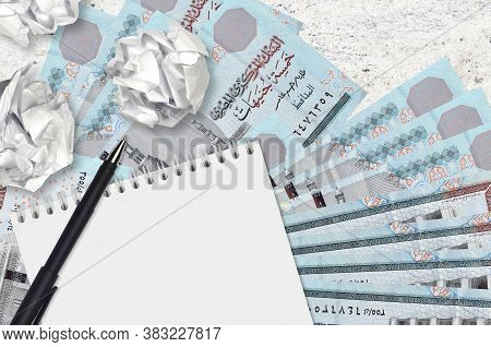 5 Egyptian Pounds Bills And Balls Of Crumpled Paper With Blank Notepad. Bad Ideas Or Less Of Inspira