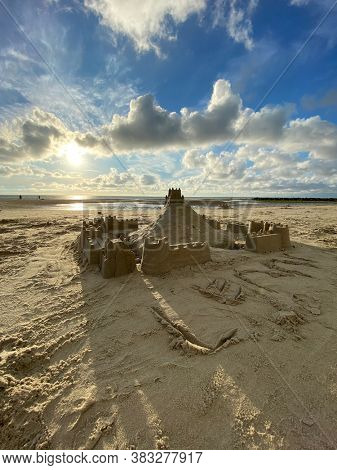Backlight of the sun on sand castle on Wimereux beach, Opal coast