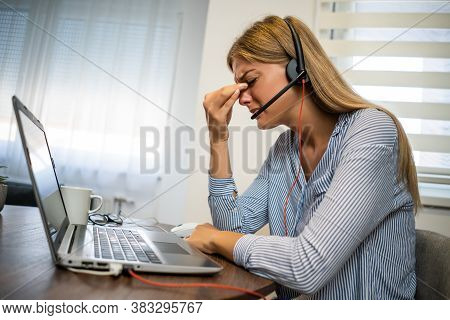 Young Modern Woman Is Working From Home. She Is Having Pain In Her Eyes.