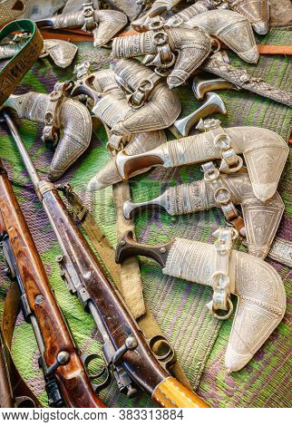 Khanjars and rifles on display at the gun Friday market in Nizwa, Oman