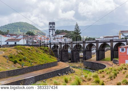 View of the bridge and church tower in Ribeira Grande town, Sao Miguel island, Azores, Portugal.