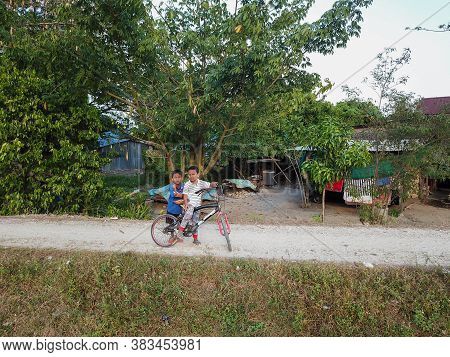 Seberang Perai, Penang/malaysia - Mar 20 2020: Malays Kid Cycle At Kampung.