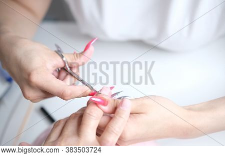 Cuticle Removal With Scissors. Nail Care, Manicure In The Salon