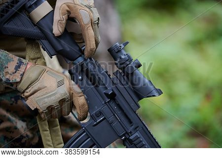 marine corps special operations soldier preparing tactical and commpunication gear for action battle closeup