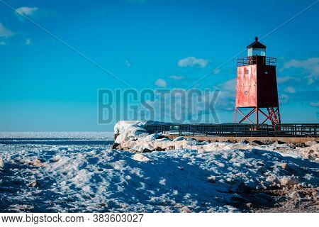 Charlevoix, Mi /usa - March 2nd 2018:  Charlevoix Michigans South Pier Lighthouse Frozen Over