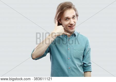 Call Me. Portrait Of Funny Handsome Long Haired Blonde Young Man In Blue Casual Shirt Standing With
