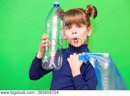 Girl Hold Trash Bag And Plastic Bottle And Shows Interest In Environmental Issues Isolated On Green 