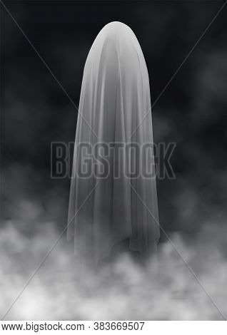 Scary Ghost On A Dark Background In The Fog. An Evil Spirit With A Covered Sheet. Halloween Poster. 
