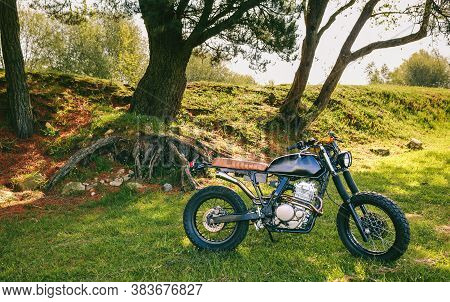 Beautiful Vintage Custom Motorcycle Parked In The Field