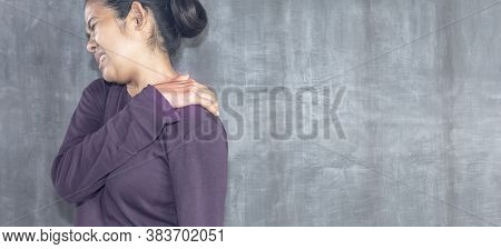 Young Asian Woman With Neck Pain On Concrete Wall For Texture Background With Copy Space, Muscles Pr