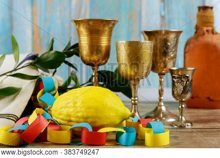 Jewish Festival Of Sukkoth Over Paper Colorful Chain Garland On Species Lulav Kippah