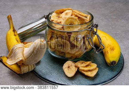 Healthy Snack, Crispy Dehydrated Unsugared Banana Chips In Glass Jar