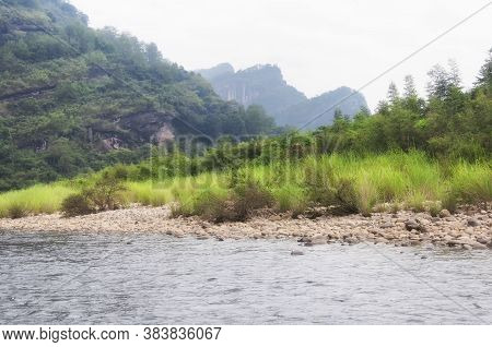 Nine Bend River Seen From The Top Of Tianyou Peak In Wuyishan, Fujian Province China On A Hazy Summe