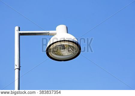 Modern Street Lamp With Led Light On Blue Summer Sky