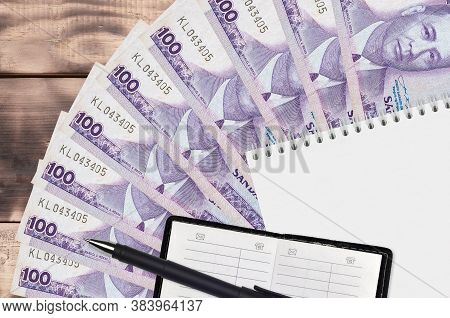 100 Philippine Piso Bills Fan And Notepad With Contact Book And Black Pen. Concept Of Financial Plan