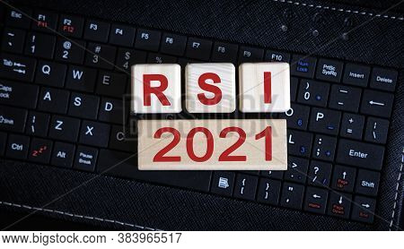 Rsi 2021 Concept. Wooden Cubes On A Black Keyboard