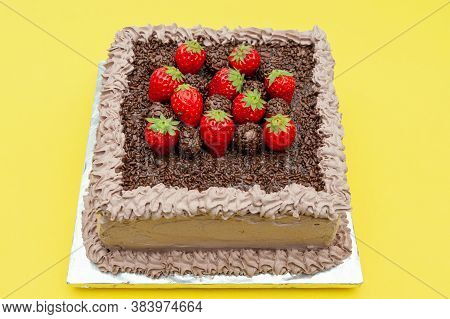 Homemade Chocolate Cake Covered With Chocolate Sprinkles And Fresh Strawberries. Known In Brazil As 