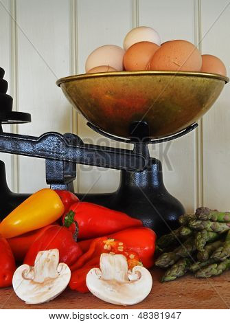 Old Fashioned Scales With Eggs And Vegtables