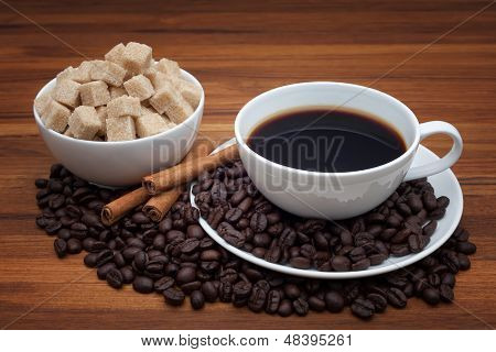 Coffee Cup And Saucer On A Wooden Table