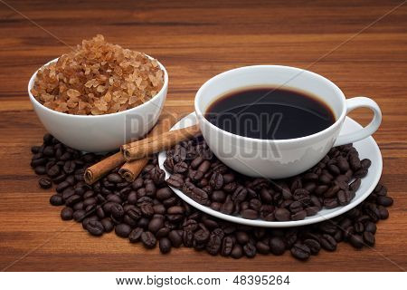 Coffee Cup And Beans On Wood Table