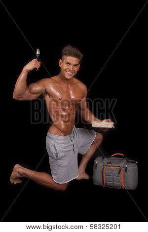 Man No Shirt Shiny Kneel By Bag With Food Fork Up