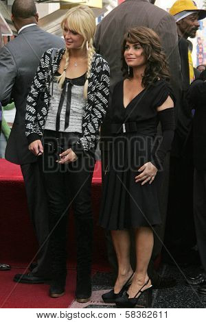 Paris Hilton and Paula Abdul at the Ceremony Honoring Los Angeles Lakers Owner Jerry Buss with the 2,323rd star on the Hollywood Walk of Fame. Hollywood Boulevard, Hollywood, CA. 10-30-06