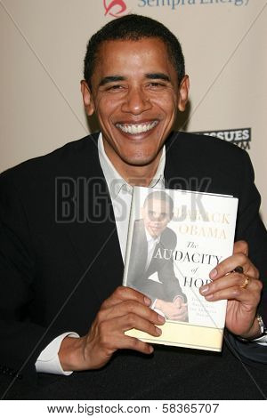 Barack Obama signing copies of his book 